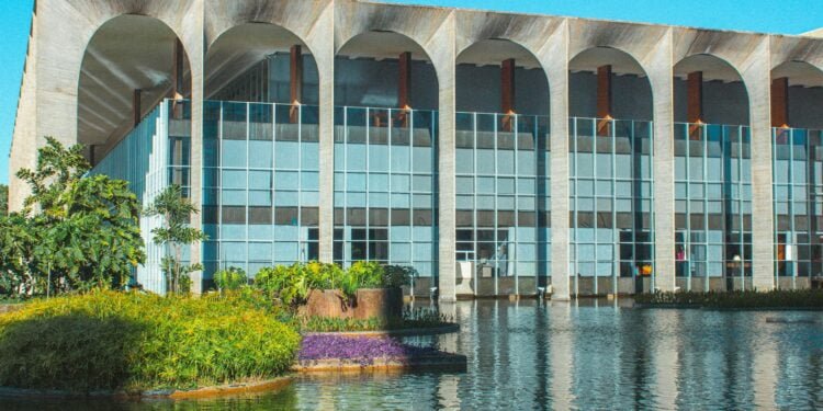 A large building sitting next to a body of water