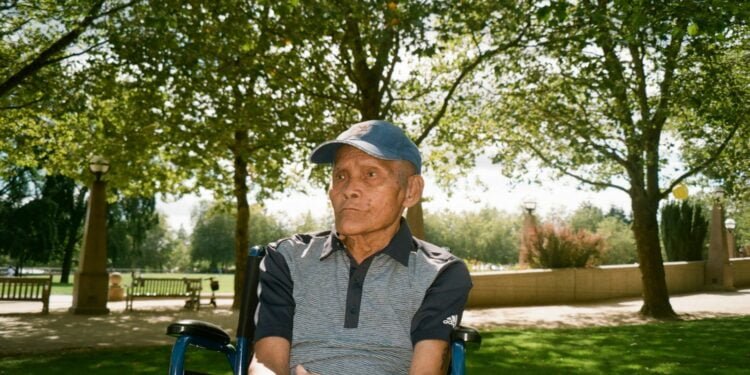 a man sitting in a park