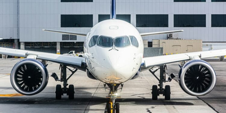 a large jetliner sitting on top of an airport tarmac