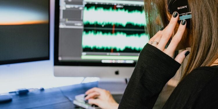 woman in black long sleeve shirt using black laptop computer