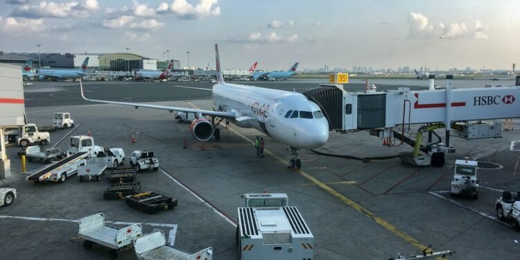 a large jetliner sitting on top of an airport tarmac