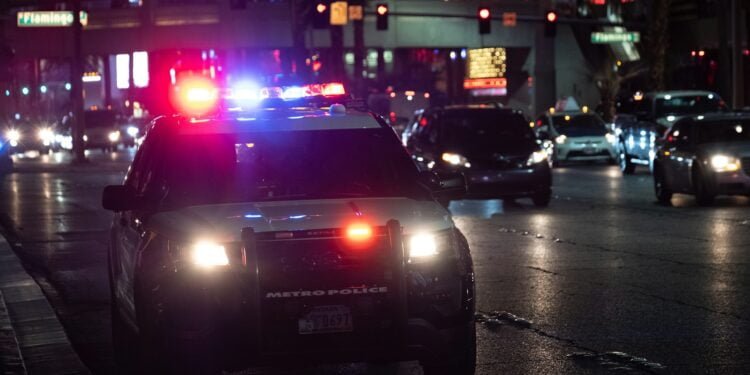 black car on road during night time
